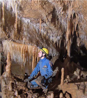 Susan Burr enjoying pretty formations.  Photo by Dave Socky
